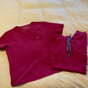 Figs Scrub Set with Blue Drawstring joggers in raspberry sorbet color.